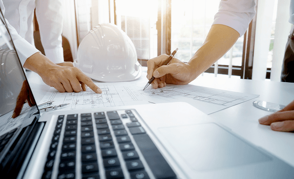 Construction plans on laptop